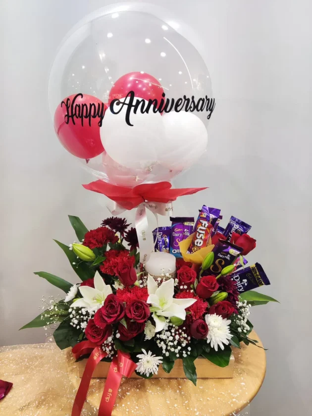 Anniversary balloon with chocolate and fresh flowers