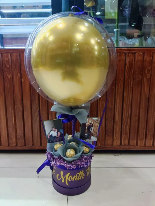 Golden balloon inside a bobo balloon