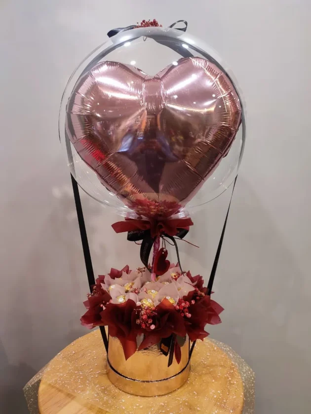 Heart shape balloon with chocolates