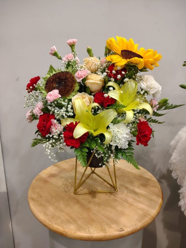 vibrant flower arrangements with stand