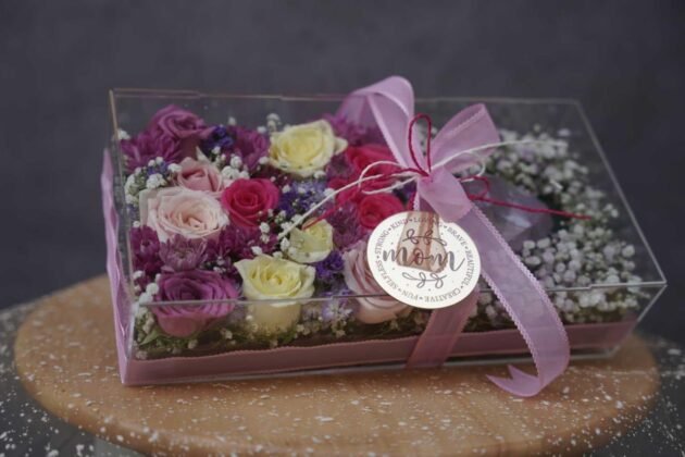 acrylic box of flowers and purple heart chocolate