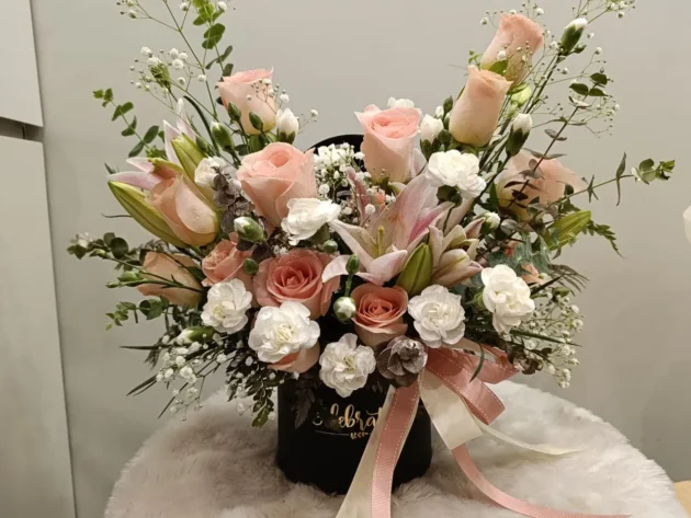 Peach white arrangement in black box