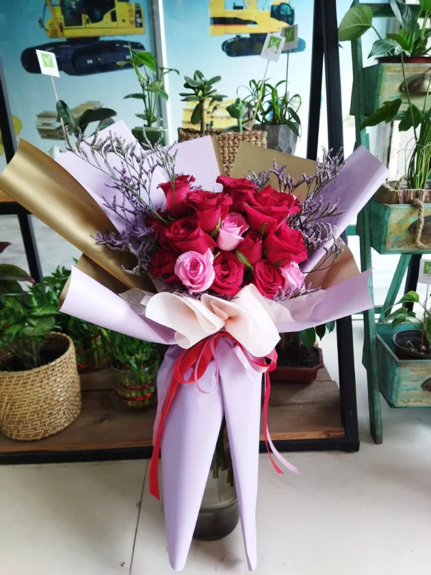 Red and Pink roses in Purple Wrap