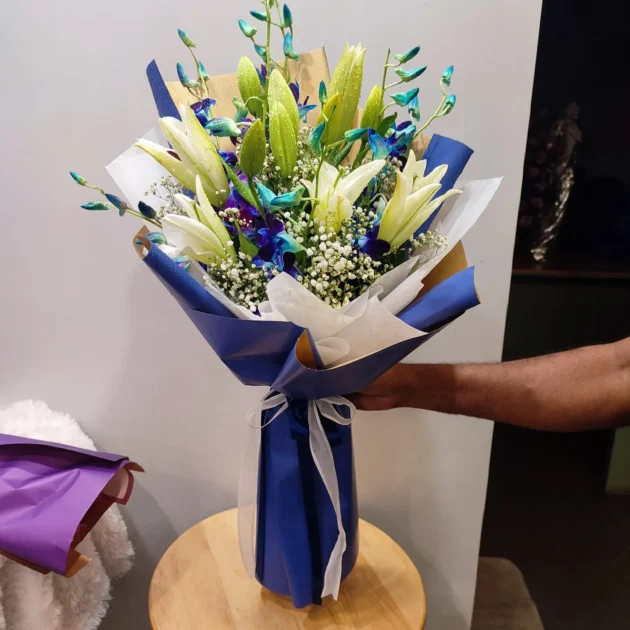 blue orchid and white lily bunch