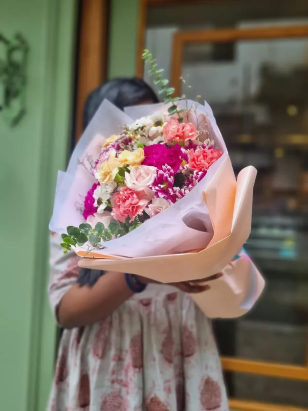 shades of pink purple and peach in one bouquet