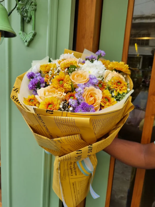 batch_yellow purple flowers in newspaper wrap